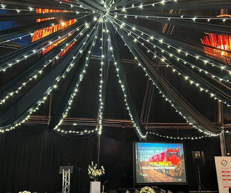 Marquee with fairy-light canopy and projector screen